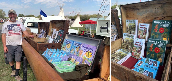 Tom Elpel selling books out of treasure chests in a canoe.